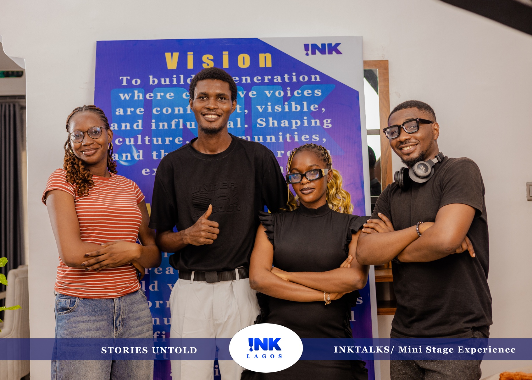 Virtue David with attendees in front of the INK Talks vision board